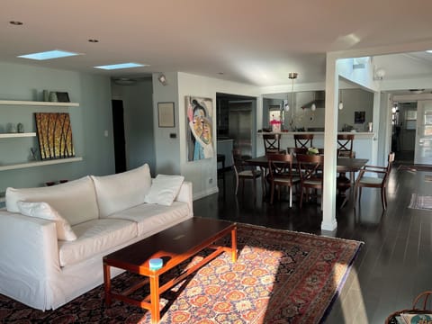 The kitchen flows into the dining area and into the living room.