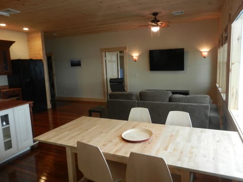 Kitchen table, living room, flat screen TV, cable, DVD Player