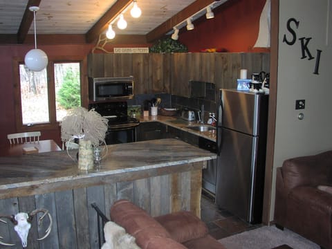 Spacious kitchen with all the amenities of home- granite & stainless appliances 