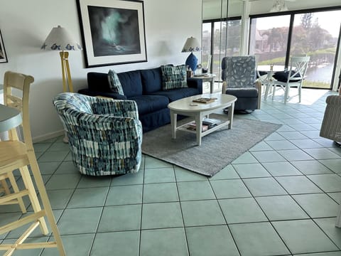 Relax in new swivel rocker and sofa as you watch the big screen TV. 
