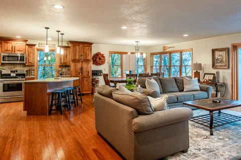 Open concept living room with amazing views and access to deck