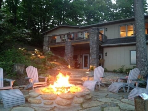 Back of home (view side) in evening at fire pit