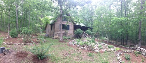 Rock-lined gardens and goldfish pond.
