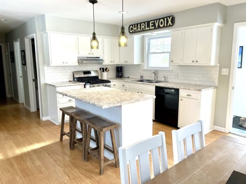 Dining area seats 6+ people, with 3 more able to sit at the kitchen island.