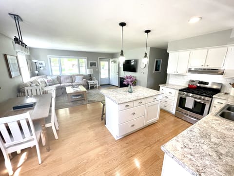 Main Living Area: View from kitchen looking out to the front entrance & porch.