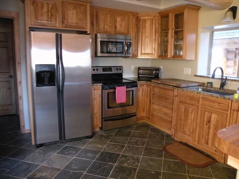 Kitchen with door to the main floor bathroom on left.