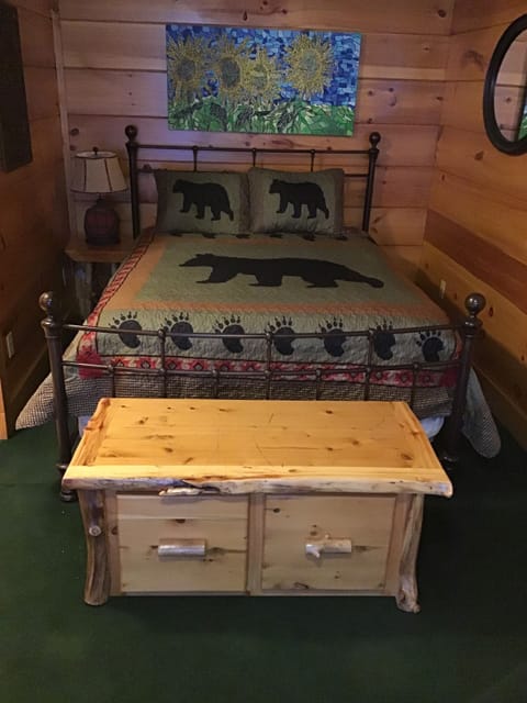 Bedroom--queen iron-framed bed; aspen bench unit with  2 drawers (made locally)
