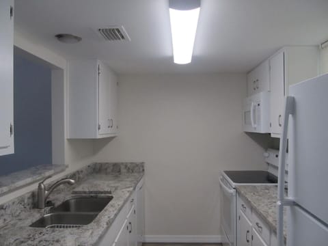 Galley Kitchen with new Granite Counter Tops.