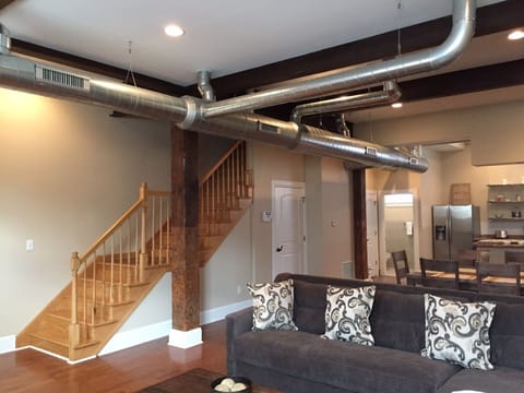 Exposed ductwork and support beams lend an industrial feel to our space