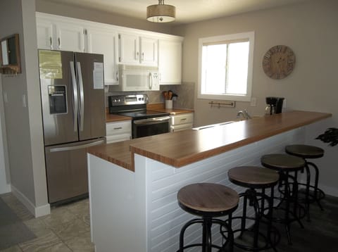 Kitchen has all newer appliances and well stocked cabinets