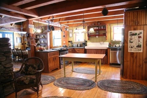 Kitchen w/ open lake view dining room on left.