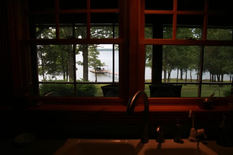 View of lake, backyard and dock from the kitchen window.  