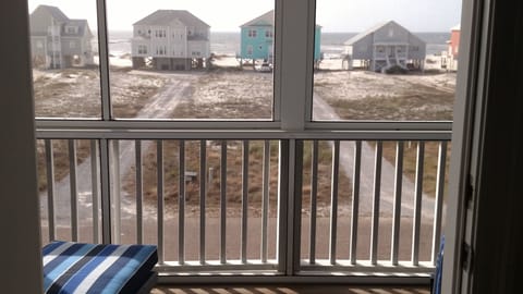 View of Gulf from 2nd story screened-in balcony; relax, enjoy the view & sounds