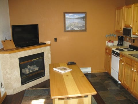 Fireplace, kitchen and table