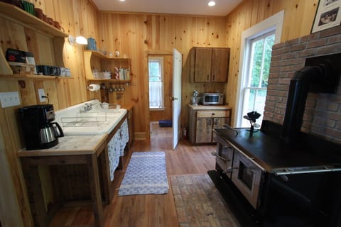 Enjoy the wood stove and old fashioned farmhouse sink.