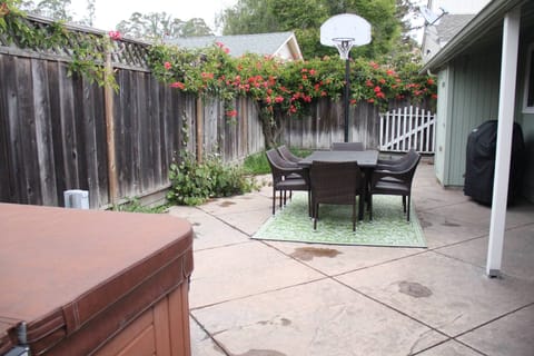 Outdoor dinette with Weber gas grill.