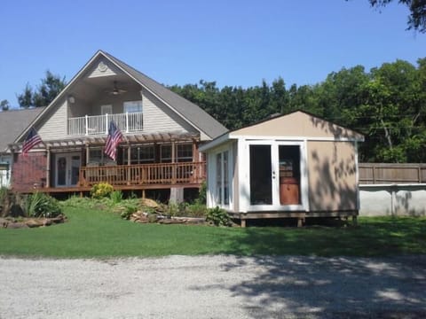 Horseshoe INN from the lake view. Swimming pool behind small building.