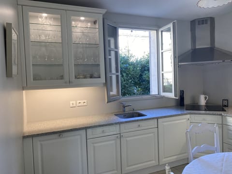 Kitchen with window on to Villa Nova garden 