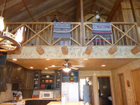 A view from downstairs to deck and kitchen