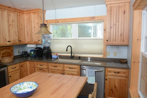 Full kitchen, refrigerator, oven, dishwasher, microwave and water dispenser.