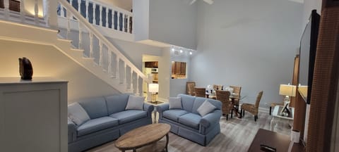 Living room and stairs to loft area