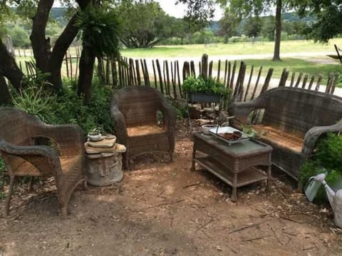 The intimate and private courtyard under the shady trees is the perfect place to chat, snuggle, and enjoy the amazing Hill Country views.