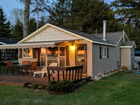 Enjoy a view of the lake from the welcoming deck with retractable awning!