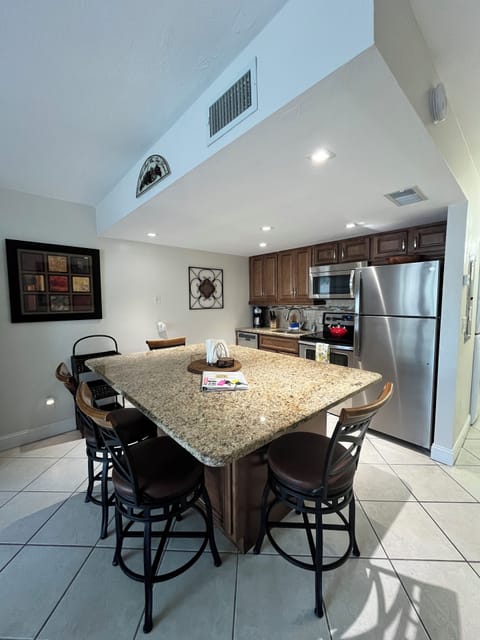 Fully-equipped kitchen with granite countertops and stainless appliances.