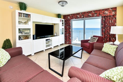 Living room with ocean view and newer curtains & sleeper sofa for extra guests!