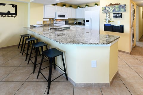 Additional bar seating & larger granite island for bigger family/friend groups!