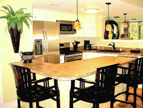 Kitchen with extra seating at the bar.