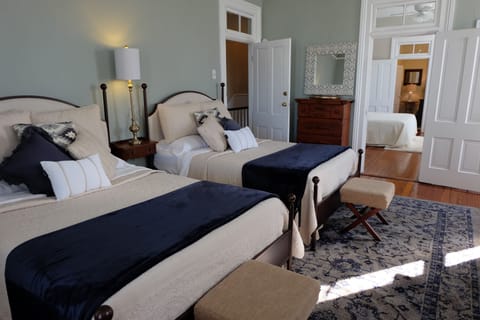 2 full-size beds sleep up to 4 in this bedroom