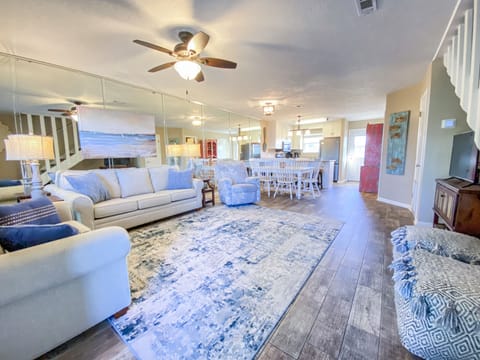 Open design showcasing living room, dining area, & kitchen