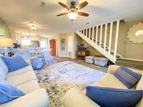 Living room & stairs leading to bedrooms