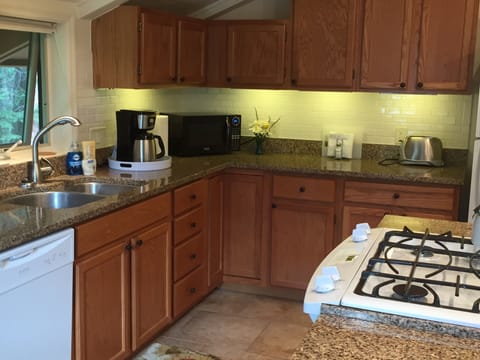 Kitchen with open concept next to living room 