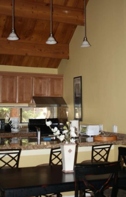 Vaulted ceiling, pendant lighting in remodeled kitchen