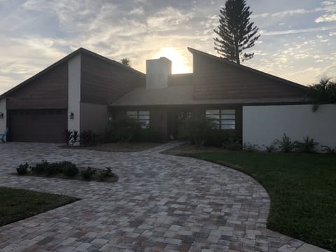 Front of house with large circular driveway with plenty of parking 