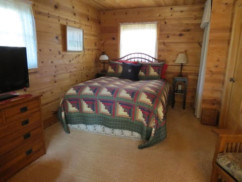 Comfy queen size bed with feather bed and down comforter