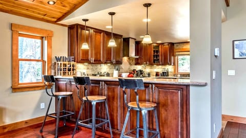 Expansive breakfast/coffee bar with 3 bar-height stools & mountain views! 
