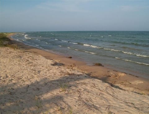 Clean sand beach with shallow water for children