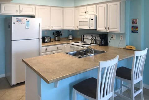 Kitchen with breakfast bar for extra seating at meal time