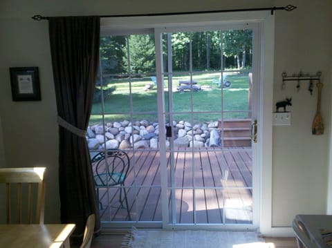 view past dining area to one of two sliders to back yard