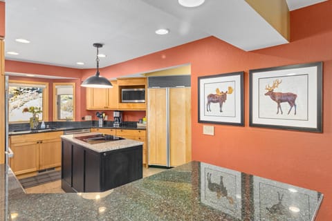 Bright, modern kitchen with spacious island and warm accents