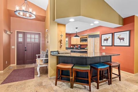 Warm, open kitchen with breakfast bar