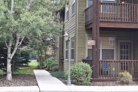 Front Exterior of Condo with Patio Seating, large propane BBQ Grill