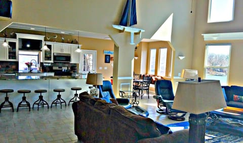 View of Kitchen, dining room and great room - all overlooking the lake! 