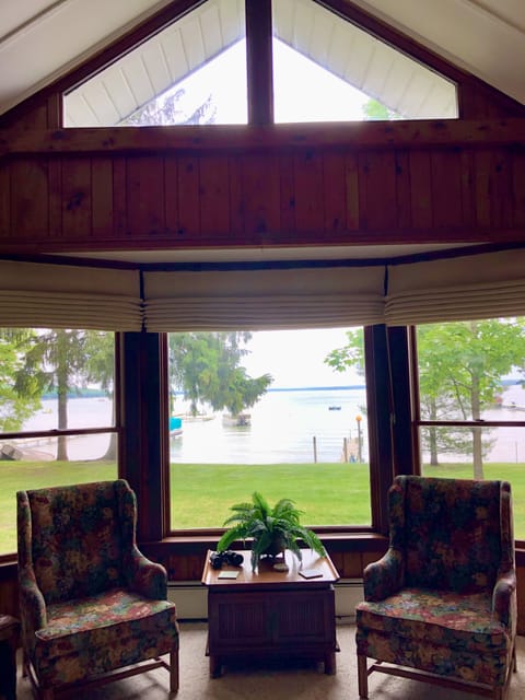 Great room bay, prow, & door wall windows with scenic lake views