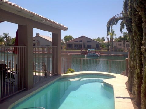 Pool with lake in background.