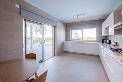Spacious kitchen with access to the outdoor area.