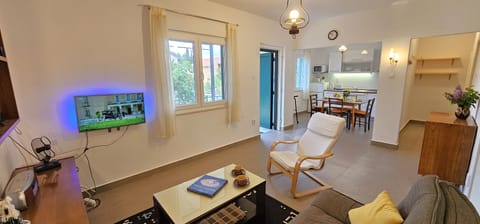 Open plan living room with dining room and kitchen